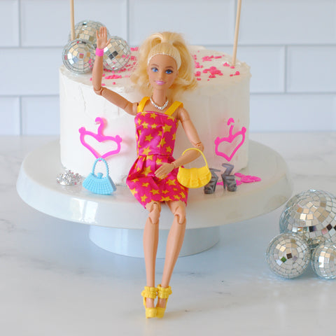 Easy Barbie birthday cake idea with Barbie sitting on cake stand