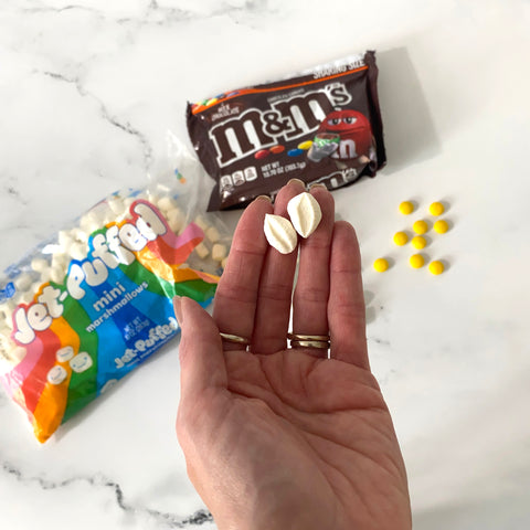 Marshmallows and M&M's to make daisies for cake decorations 