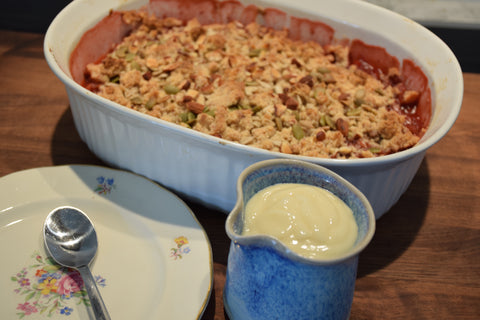 Rhubarb and strawberry crumb pie with vanilla sauce