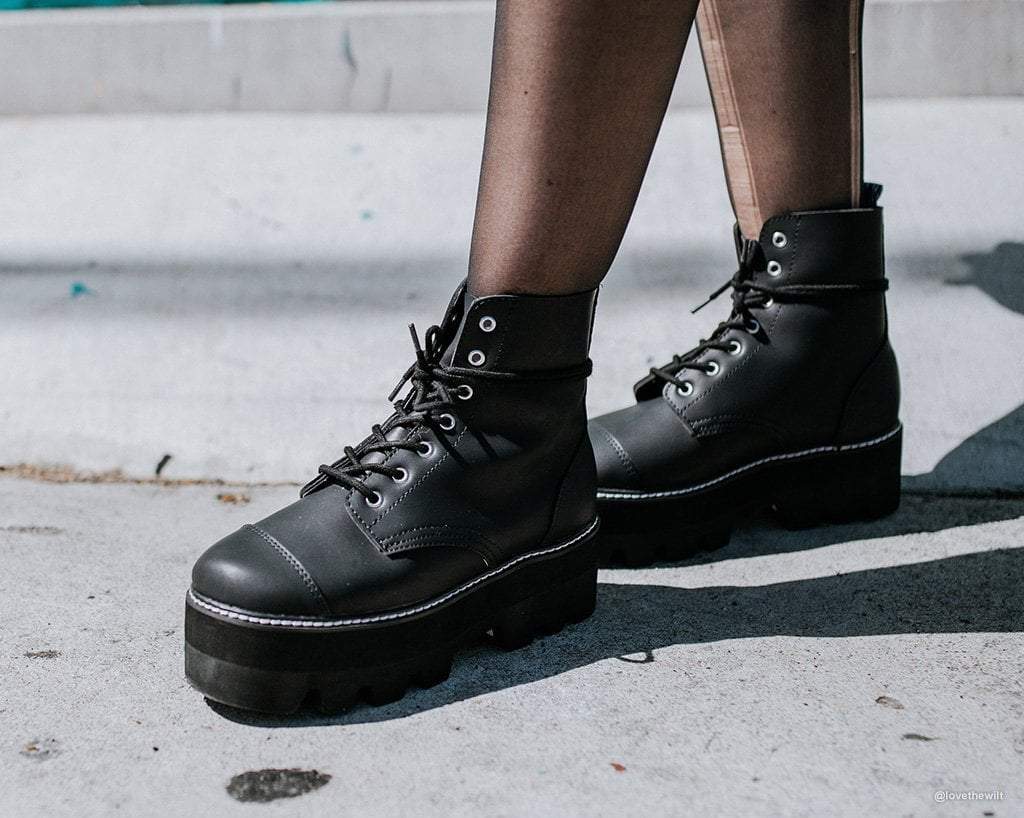 Black Faux Leather 7-Eyelet Dino Lug Sole Boots