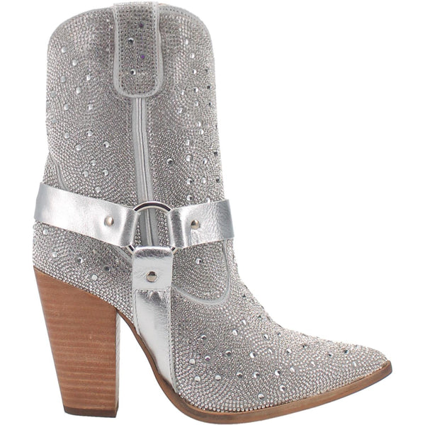 A small silver bootie with rhinestones top to bottom, tall heel, V cut at the top, matching straps, and leather straps going through the middle and under the boot. Item is pictured on a plain white background