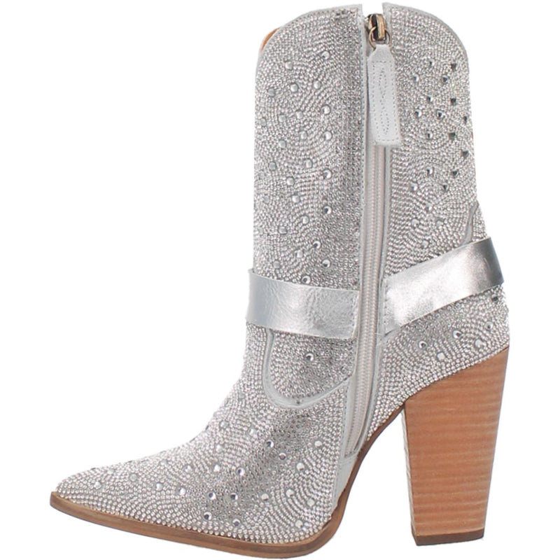 A small silver bootie with rhinestones top to bottom, tall heel, V cut at the top, matching straps, and leather straps going through the middle and under the boot. Item is pictured on a plain white background