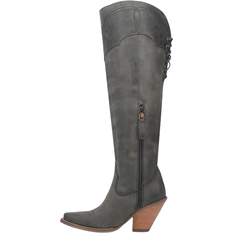 A tall black leather boot with a short heel, stitched desings at the top and bottom, lace up back, fringe down the right side, and a half zipper. Item is pictured on a plain white background