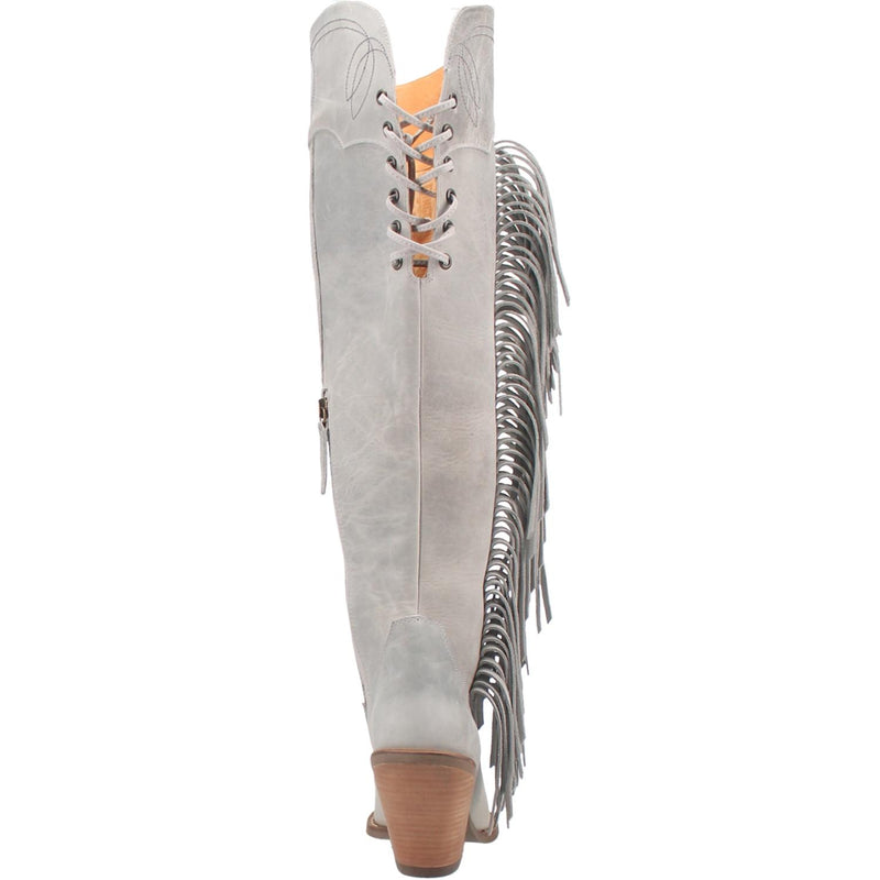 A tall white leather boot with a short heel, stitched desings at the top and bottom, lace up back, fringe down the right side, and a half zipper. Item is pictured on a plain white background