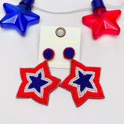 Big Beaded Star Earrings in Red, White, and Blue. Pictured on a white background with a red and blue star above for decoration.
