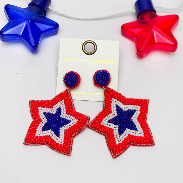 Big Beaded Star Earrings in Red, White, and Blue. Pictured on a white background with a red and blue star above for decoration.