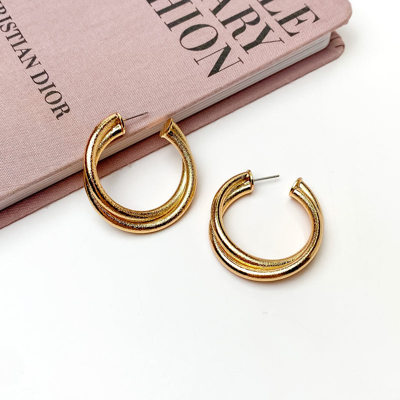 Twisted Hoop Earrings in Textured Gold Tone