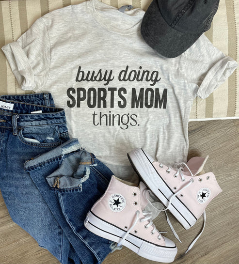 Busy Doing Sports Mom Things Short Sleeve Graphic Tee in Grey