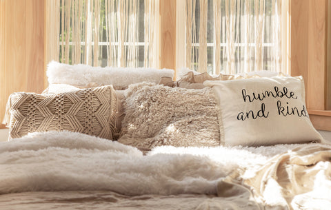 Curated pillows on a bed