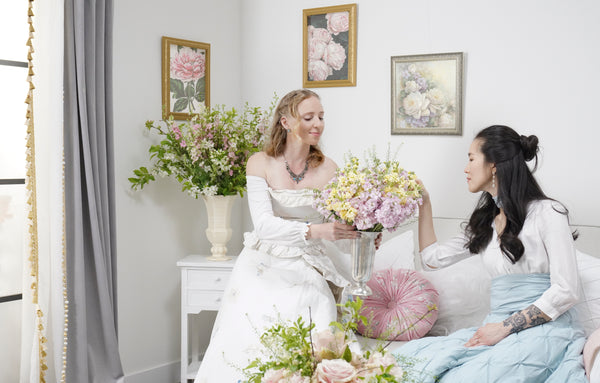 Models dressed in Bridgerton style Lush Decor Comforters