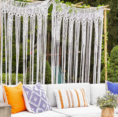 Outdoor couch with pillows and curtain