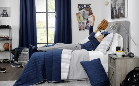 Boy laying down in bed 