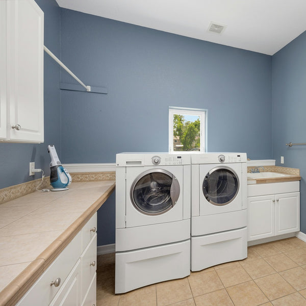 washing machine and dryer in laundry room