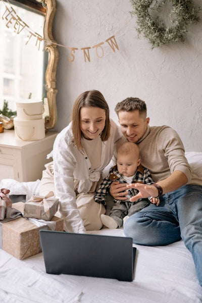 young family video conferencing with distant relatives