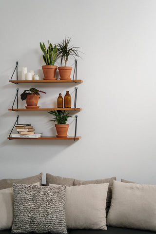 cute shelves above a sofa