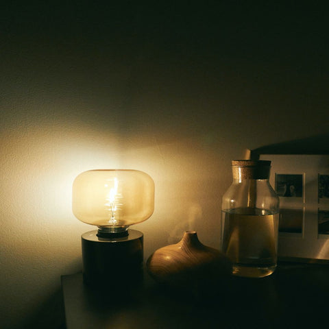 water bottle and light on night stand