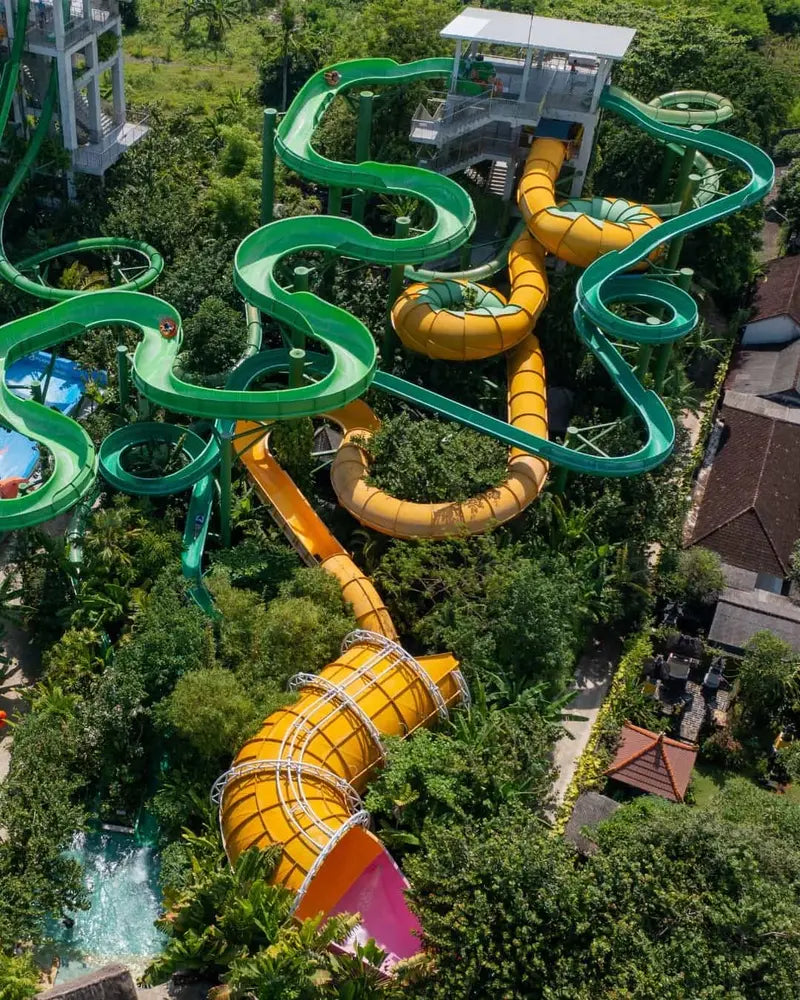 The twisting and turning multi-coloured water slides of Water Bom in Kuta, Bali from a birds-eye-view.