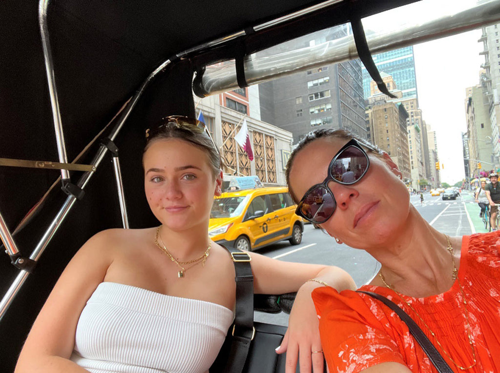 A selfie of Olga Valentine owner and founder, Natasha Nowak, and her daughter Francesca, riding in a New York City Rickshaw.