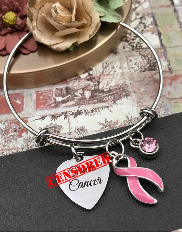 Custom Cancer Ribbon Awareness Bracelets are silver and debossed with