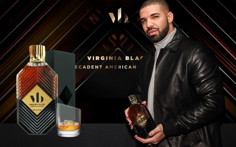 Drake posing with a bottle of Virginia Black whiskey - Image by billboard.com