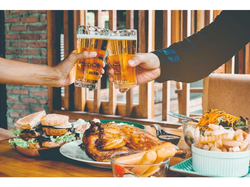  Men drinking beer and clink glasses happy