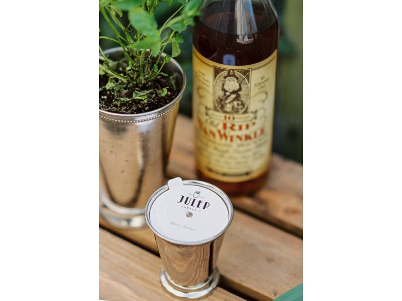  Mint Julep Candle, a plant, and liquor on a wooden table 