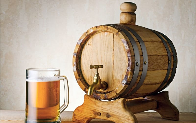 Wooden Beer Keg and Mug of Light Draft Beer