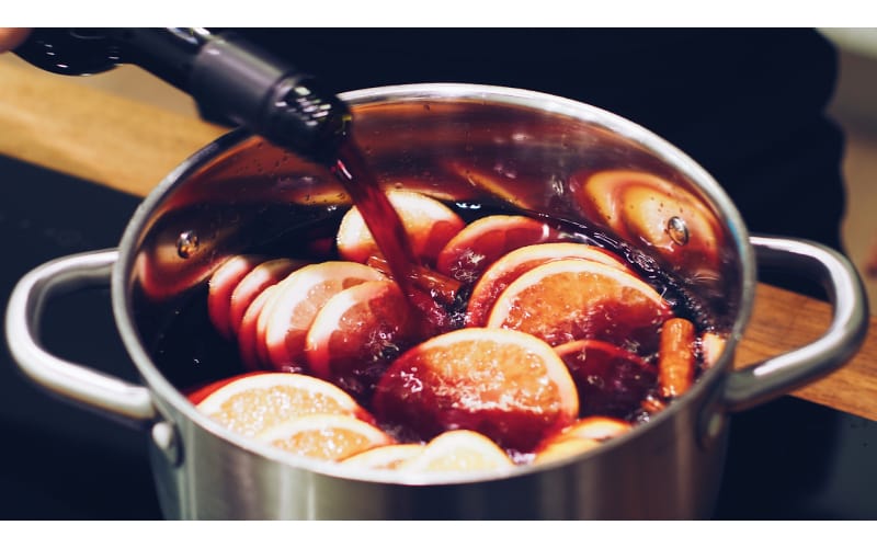 Wine being poured into a pot