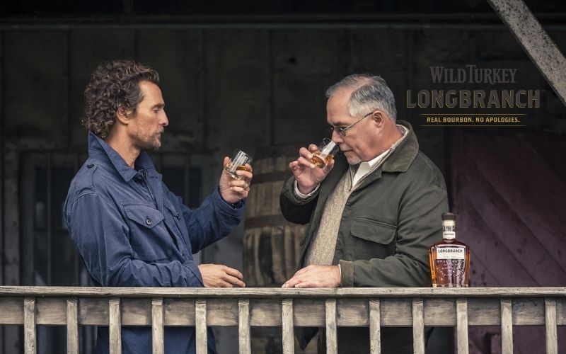 McConaughey holding a glass of Wild Turkey whiskey - Image by Wild Turkey