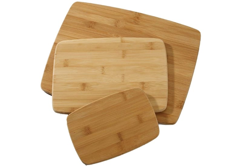 Cutting board with vegetables on the side