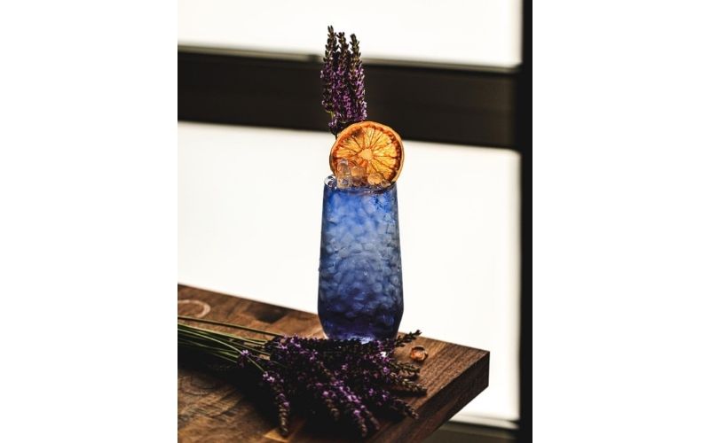 A glass of Lavender Gin Swizzle
