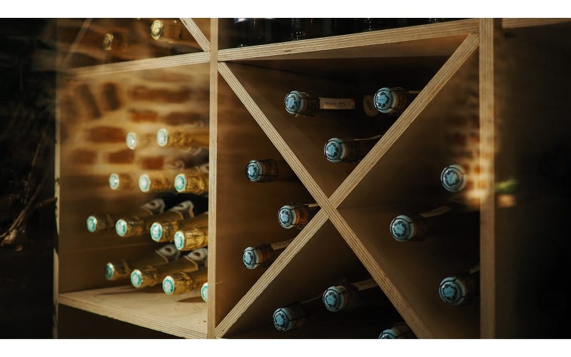 Wines stored on a wooden shelf