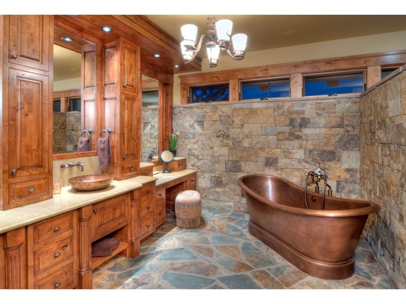 The interior of a bathroom with a copper tub