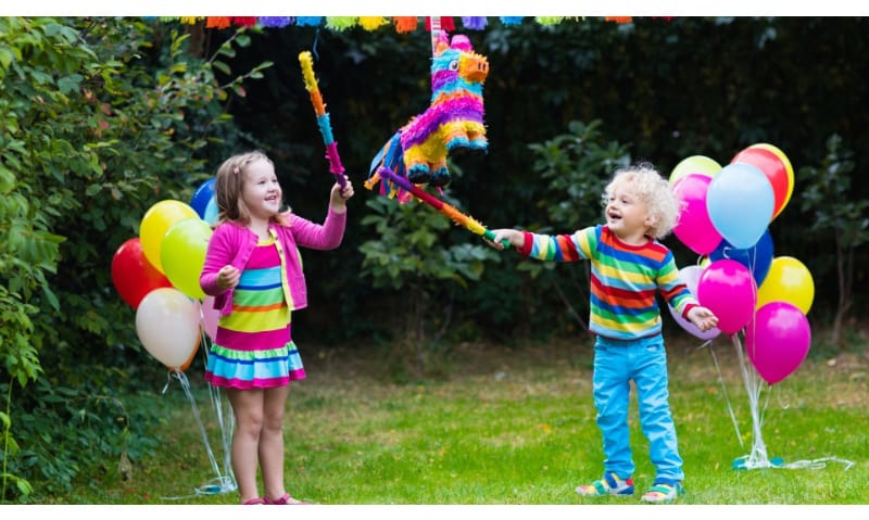 Kids playing with piñata 