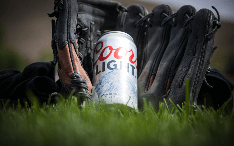 A can of Coors Light Beer with baseball mitts