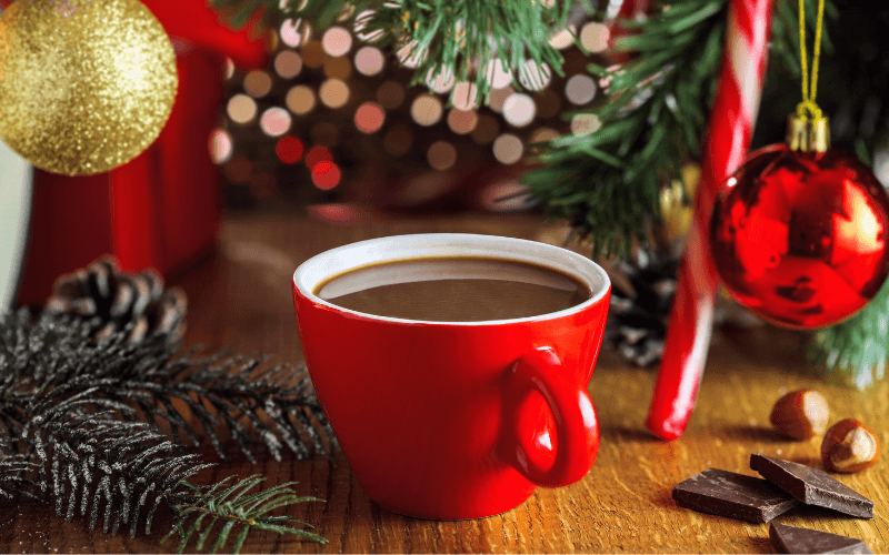 A cup of El Submarino in a Christmas background