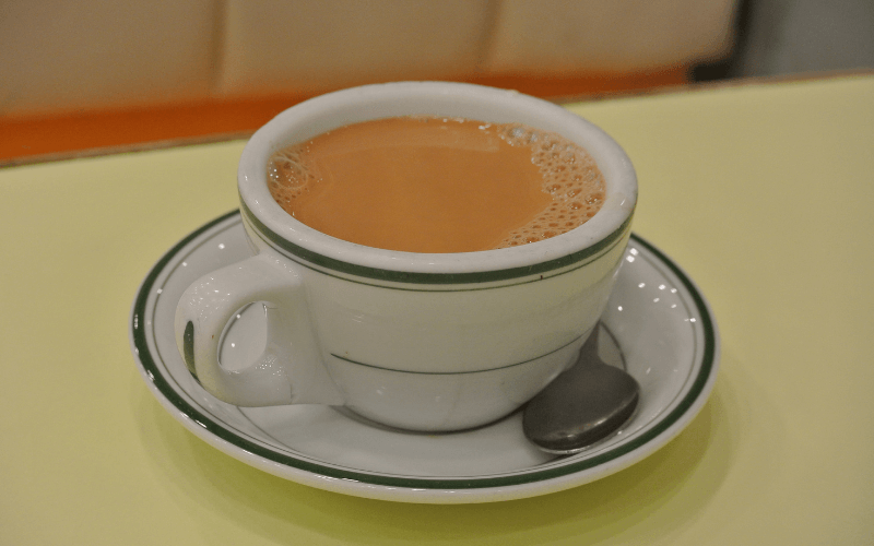 A cup of Hongkong-style milk tea in a saucer