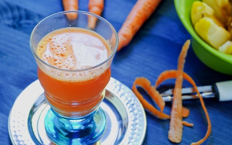 A glass of Carrot Ginger Apple Juice