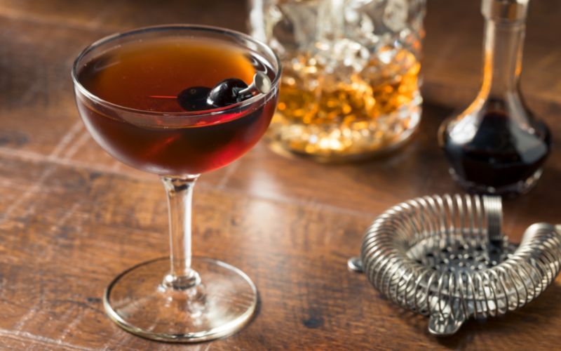 A glass of Manhattan on a table