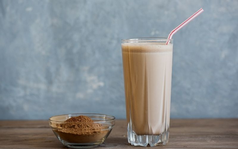 A glass of Peanut Butter Chocolate Protein Shake