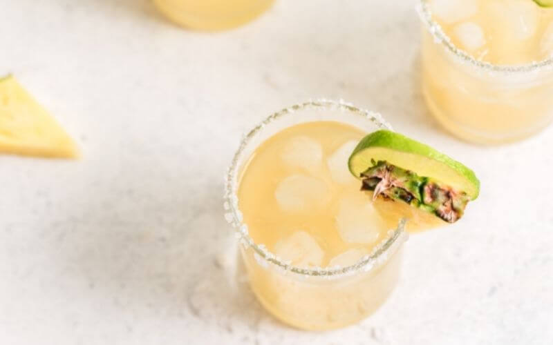 A glass of Pineapple Ginger Margarita