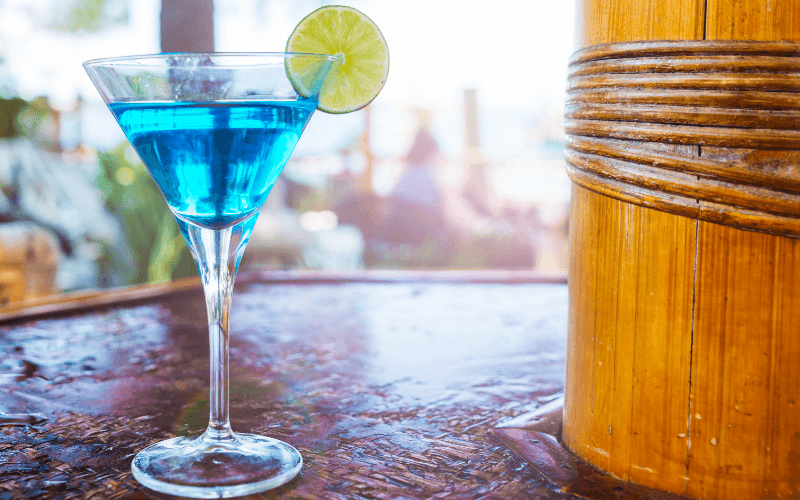 A glass of Yale cocktail with a lime wheel