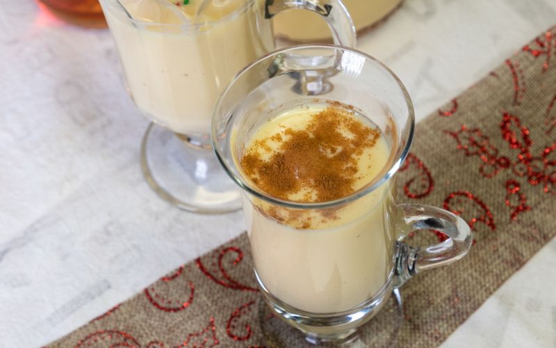 A glass of bourbon milk punch