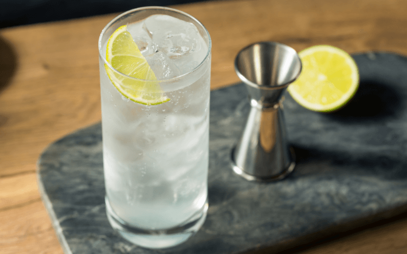 A glass of tequila tonic with lime