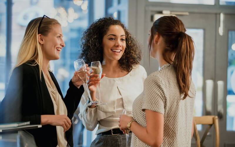 A group of ladies drinking alcohol after work