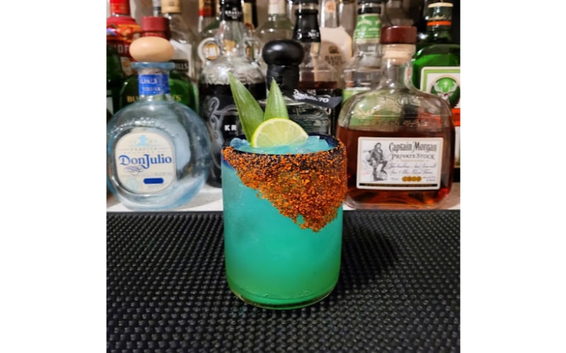 A serving of Blue Iguana in a rocks glass