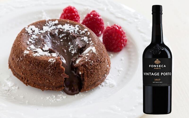 A serving of molten lava cake and a port wine bottle