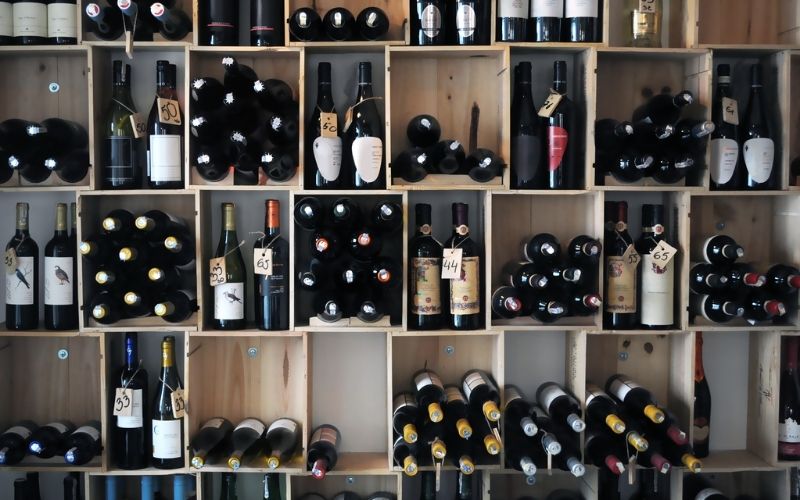 A shelf full of wines