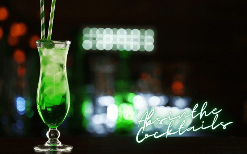 A green cocktail on a dark background