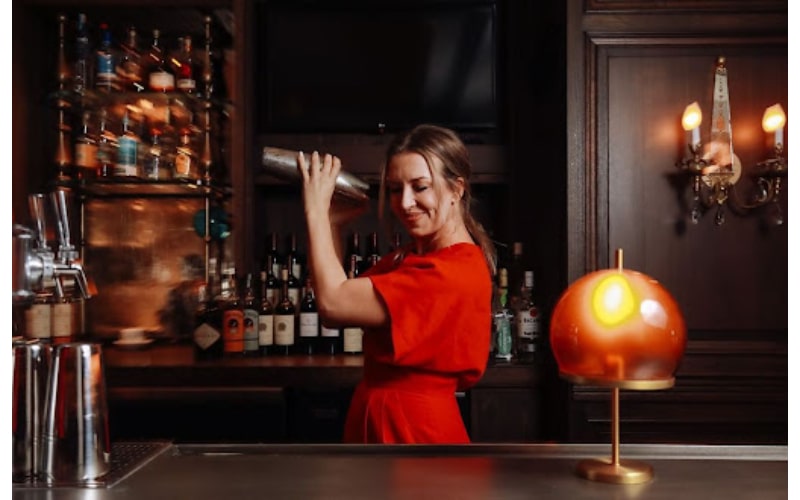 Anne Louise Marquis shaking a cocktail